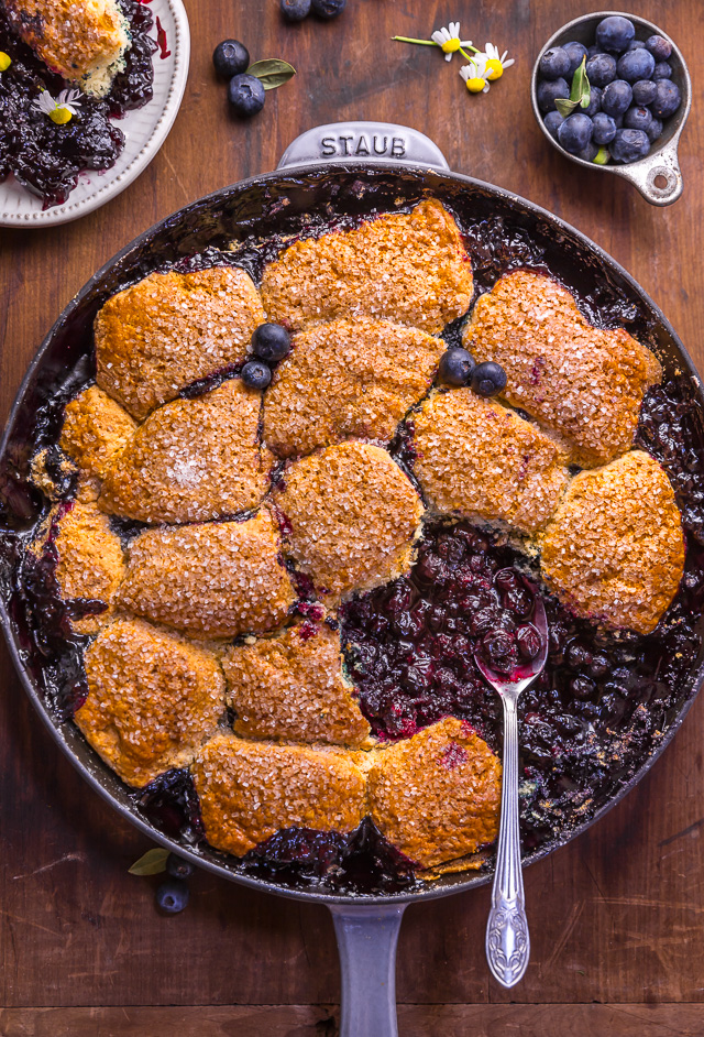 When blueberries go on sale, stock up so you can make this quick and easy blueberry cobbler recipe! Featuring the juiciest blueberry filling and a buttery biscuit topping, this Summer dessert is so good with a scoop of vanilla ice cream on top! While I always prefer to use fresh fruit, this recipe will work with fresh or frozen blueberries! #blueberrycobbler 