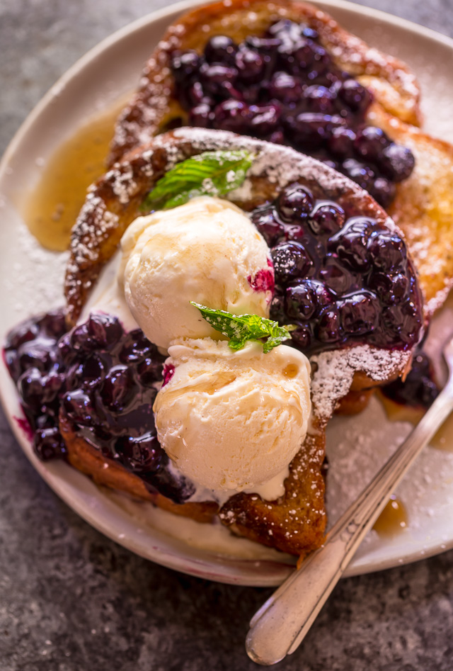 Buttery slices of brioche bread and fresh blueberry maple syrup make this recipe a total showstopper! While it's a little more work than most breakfast casseroles, it's totally worth it! This Brioche French Toast with Blueberry Compote is a great recipe for a lazy Saturday, Christmas morning, or anytime you want to make breakfast extra special! #frenchtoast #blueberrycompote #brioche #briochefrenchtoast #breakfast