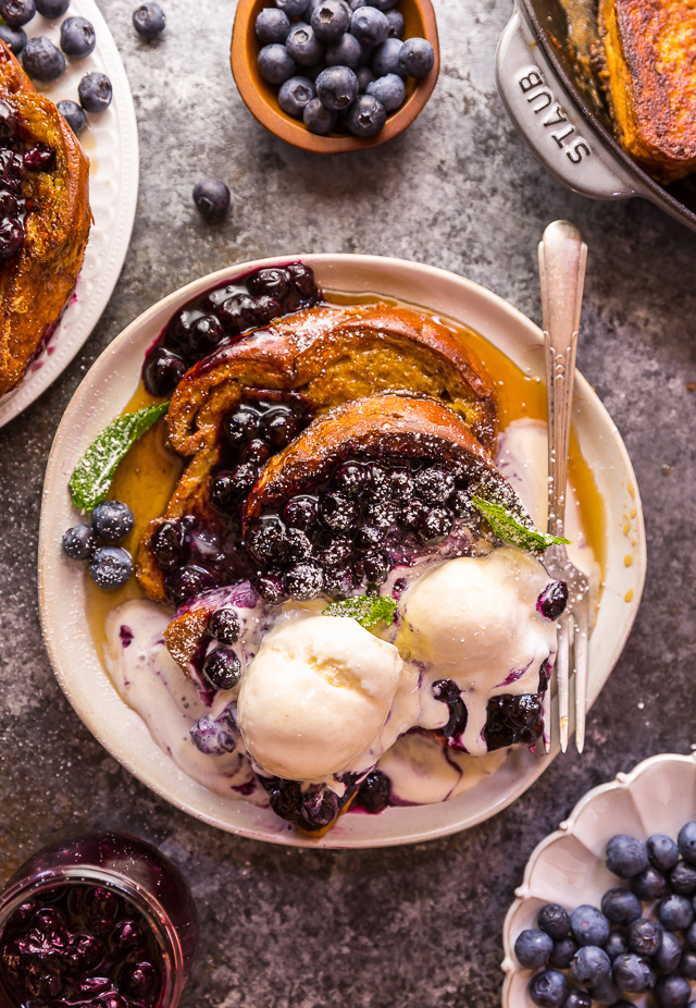 Buttery slices of brioche bread and fresh blueberry maple syrup make this recipe a total showstopper! While it's a little more work than most breakfast casseroles, it's totally worth it! This Brioche French Toast with Blueberry Compote is a great recipe for a lazy Saturday, Christmas morning, or anytime you want to make breakfast extra special! #frenchtoast #blueberrycompote #brioche #briochefrenchtoast #breakfast