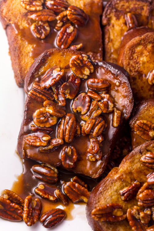 Brown Sugar Butter Pecan French Toast is a decadent breakfast that's perfect for special occasions... like Christmas morning!!! Thick slices of brioche are fried until golden brown and then topped with the most delicious brown sugar butter pecan syrup! So decadent, you don't even need to serve with maple syrup!