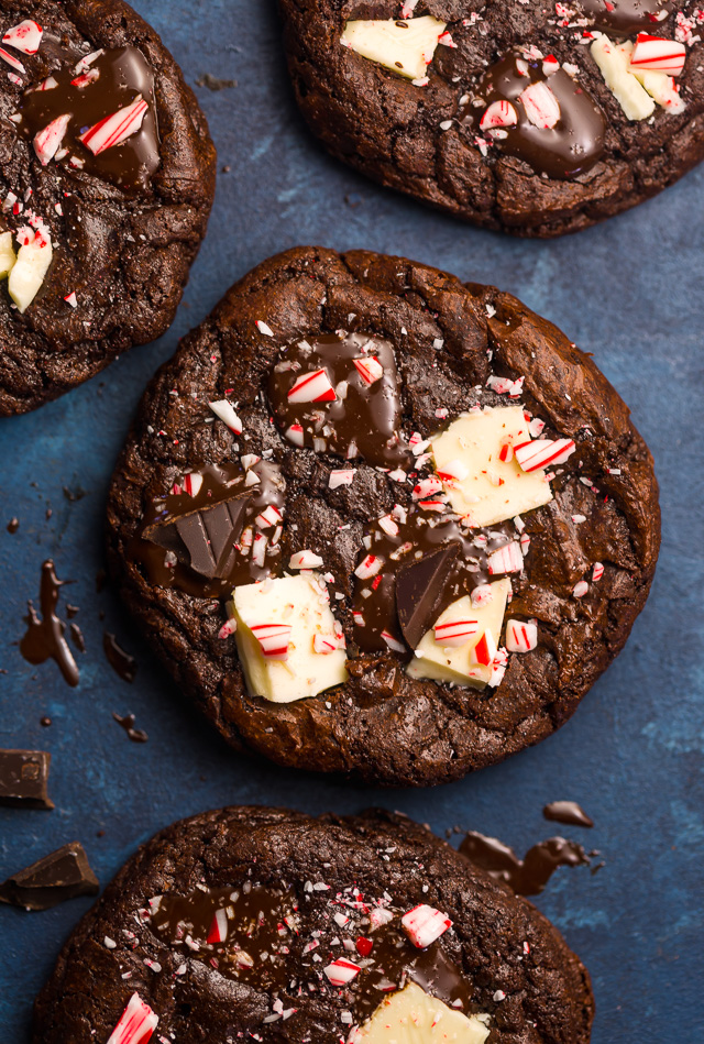 If you enjoy the combination of dark chocolate and perky peppermint, you're going to LOVE these Double Chocolate Peppermint Fudge Cookies! Topped with gooey chocolate chunks, a white chocolate layer, plus crushed candy canes, these cookies are as beautiful as they are delicious! And a must bake this holiday season!