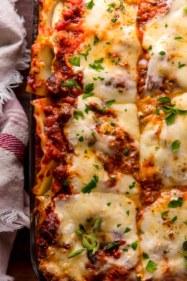 The Best Homemade Lasagna Recipe is cheesy, meaty, saucy, and SO delicious!!! And while this recipe requires a bit of work, it can be made ahead of time and stored in the fridge for up to 24 hours before baking. A hearty recipe that's perfect for feeding large groups! #lasagna #lasagnarecipe 