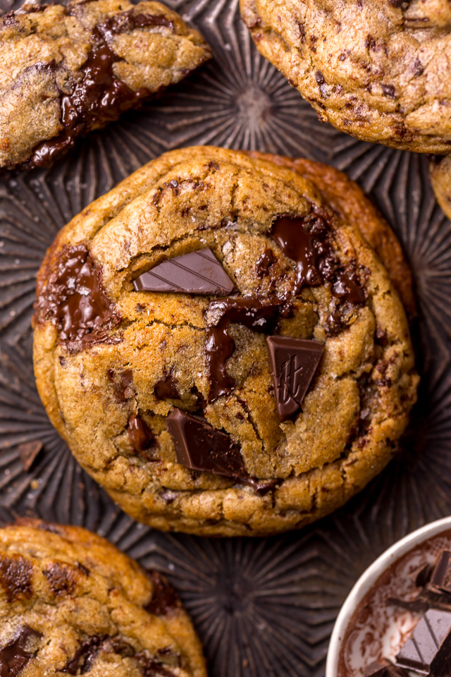 Whiskey lovers will go crazy for these Rye Whiskey Chocolate Chip Cookies! Made with a unique combination of rye flour and all purpose flour, they bake up soft, chewy, and ultra thick! Brown butter, rye whiskey, and plenty of chocolate make these grown up chocolate chip cookies totally irresistible!