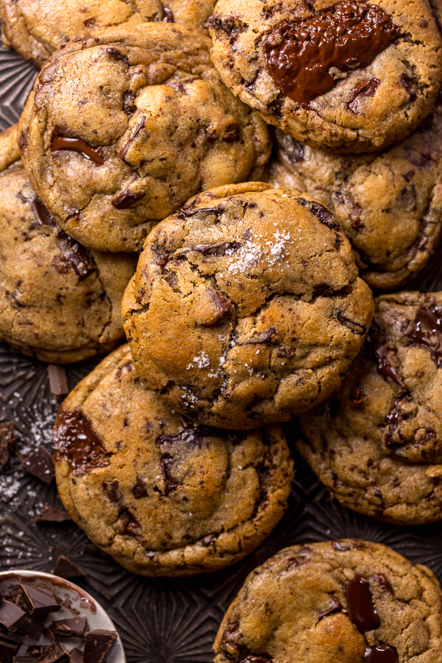 Whiskey lovers will go crazy for these Rye Whiskey Chocolate Chip Cookies! Made with a unique combination of rye flour and all purpose flour, they bake up soft, chewy, and ultra thick! Brown butter, rye whiskey, and plenty of chocolate make these grown up chocolate chip cookies totally irresistible!
