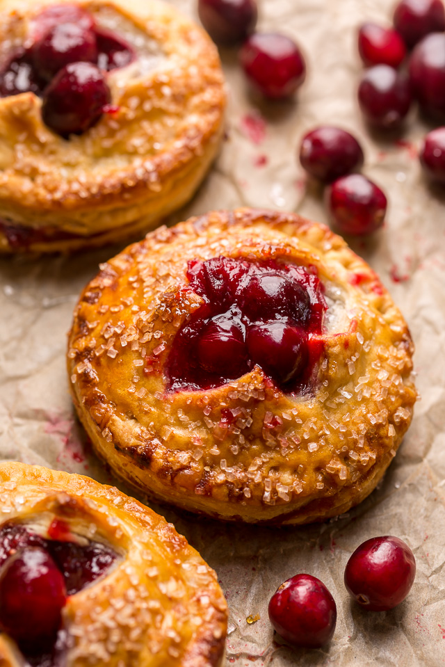 Rustic Cranberry Hand Pies feature a flaky crust and a delicious orange cranberry filling! And their petite handheld size makes them perfect for sharing this holiday season! It's just not Christmas in our house without these on the table!