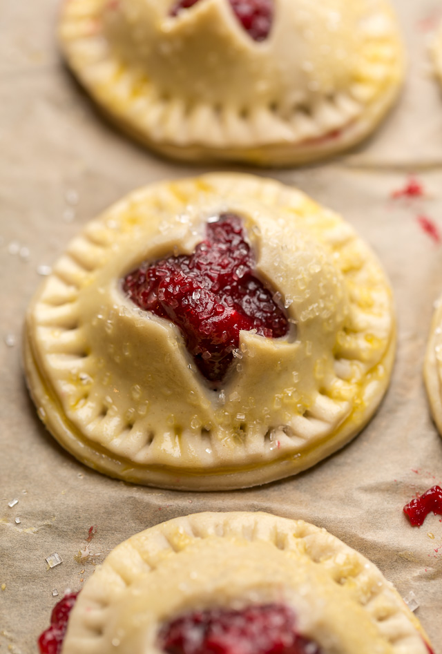 Rustic Cranberry Hand Pies feature a flaky crust and a delicious orange cranberry filling! And their petite handheld size makes them perfect for sharing this holiday season! It's just not Christmas in our house without these on the table!