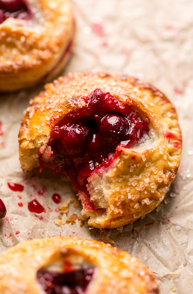 Rustic Cranberry Hand Pies feature a flaky crust and a delicious orange cranberry filling! And their petite handheld size makes them perfect for sharing this holiday season! It's just not Christmas in our house without these on the table!