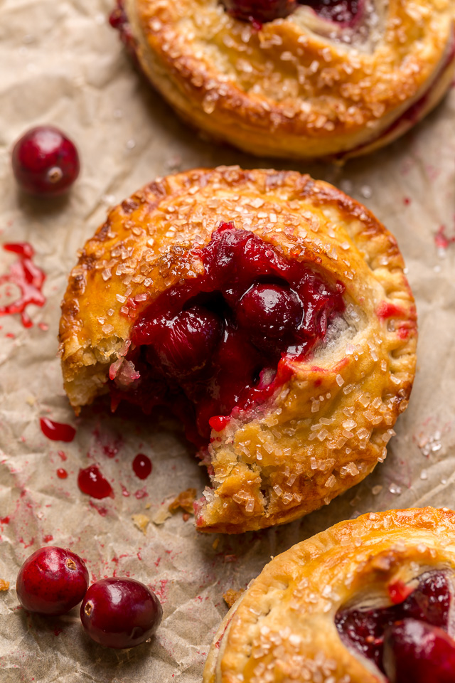 Rustic Cranberry Hand Pies feature a flaky crust and a delicious orange cranberry filling! And their petite handheld size makes them perfect for sharing this holiday season! It's just not Christmas in our house without these on the table!