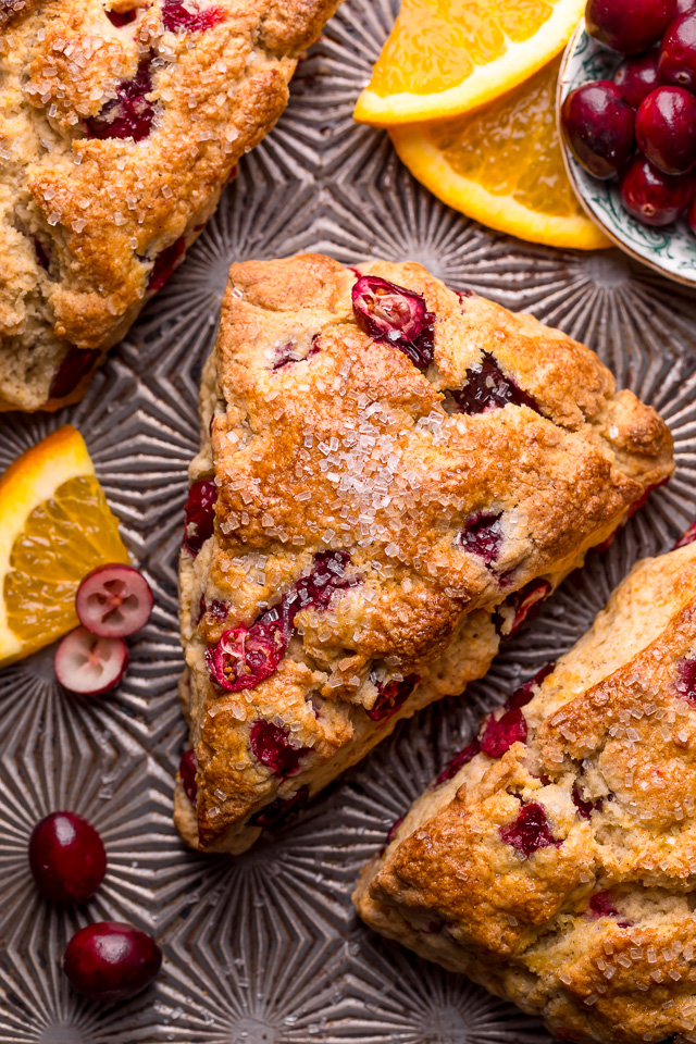 Cranberry Orange Scones are loaded with vibrant orange flavor, fresh cranberries, and topped with a sweet orange glaze! Perfect for breakfast or brunch! And one of my favorite scone recipes to make during the holiday season!