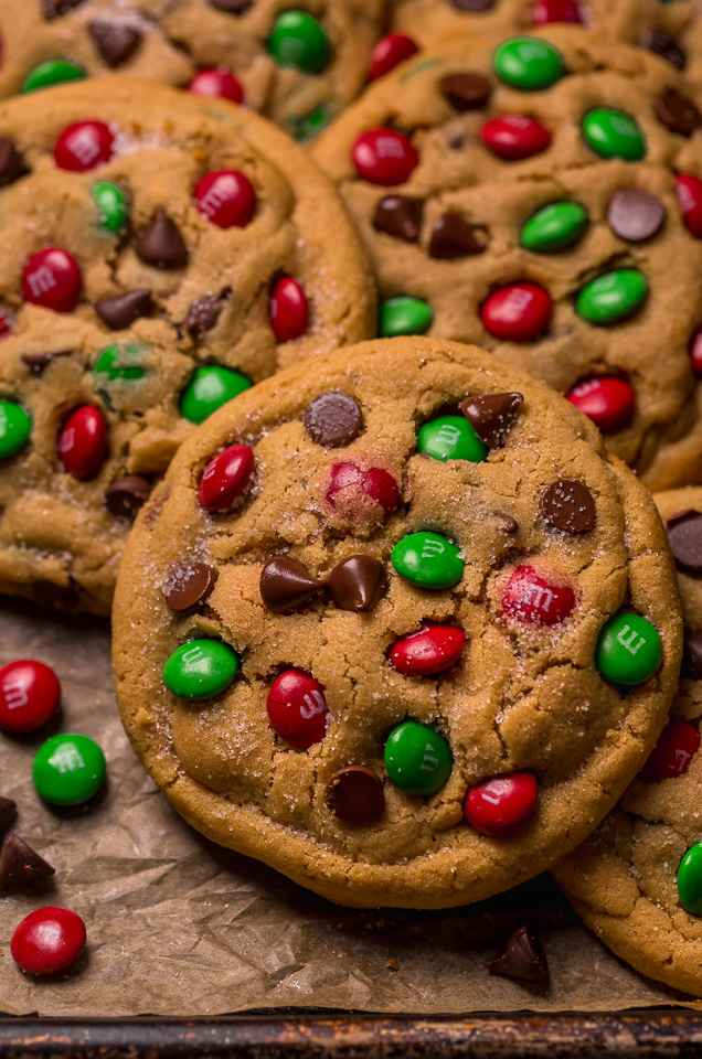 Santa's Favorite Peanut Butter M&M Cookies are thick, soft, and chewy! These GIANT bakery-style holiday cookies are loaded with peanut butter, M&Ms, and gooey milk chocolate chips! A crowd-pleasing cookie recipe that's loved equally by kiddos and adults!