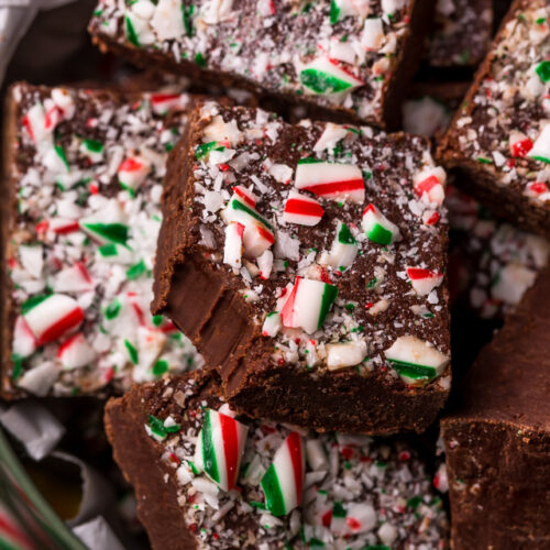 This EASY Chocolate Peppermint Fudge Recipe is rich, creamy, and topped with crunchy crushed candy canes! If you love the combination of chocolate and peppermint, you're going to love this fudge! And it makes a great holiday gift for friends and family!