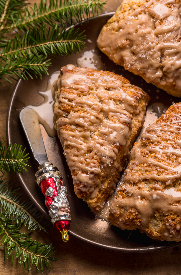 These Bakery-Style Eggnog Scones are flaky, buttery, and loaded with eggnog flavor! Topped with a sweet eggnog glaze, they're perfect for Christmas morning! Best served warm, with a cup of coffee or tea!