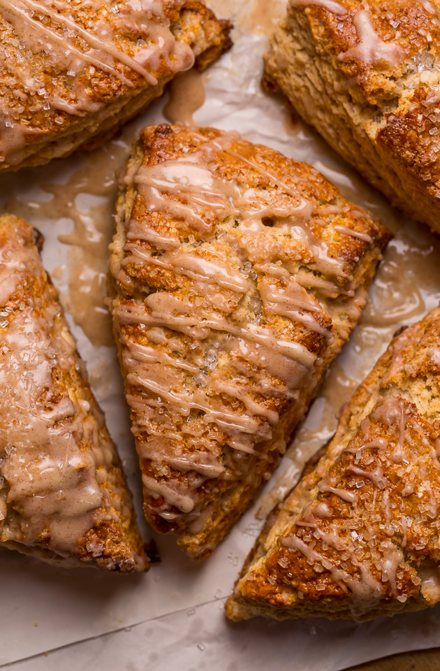 These Bakery-Style Eggnog Scones are flaky, buttery, and loaded with eggnog flavor! Topped with a sweet eggnog glaze, they're perfect for Christmas morning! Best served warm, with a cup of coffee or tea!