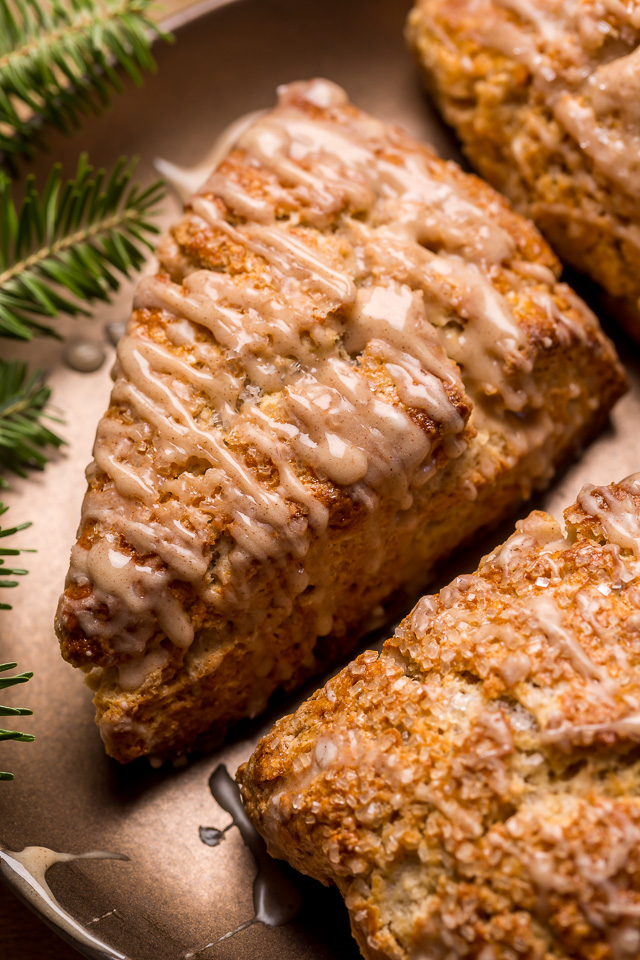 These Bakery-Style Eggnog Scones are flaky, buttery, and loaded with eggnog flavor! Topped with a sweet eggnog glaze, they're perfect for Christmas morning! Best served warm, with a cup of coffee or tea!