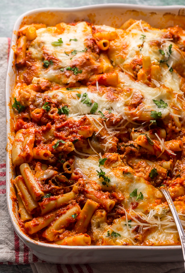 My Best Ever Baked Ziti Recipe serves a crowd and is sure to receive rave reviews! Today I'm spilling my secrets on how to master this classic pasta dish and make it better than you ever have before. Including how to achieve perfectly cooked noodles, make delicious homemade sauce, get golden brown gooey cheese pockets, and so much more.