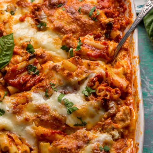 My Best Ever Baked Ziti Recipe serves a crowd and is sure to receive rave reviews! Today I'm spilling my secrets on how to master this classic pasta dish and make it better than you ever have before. Including how to achieve perfectly cooked noodles, make delicious homemade sauce, get golden brown gooey cheese pockets, and so much more.
