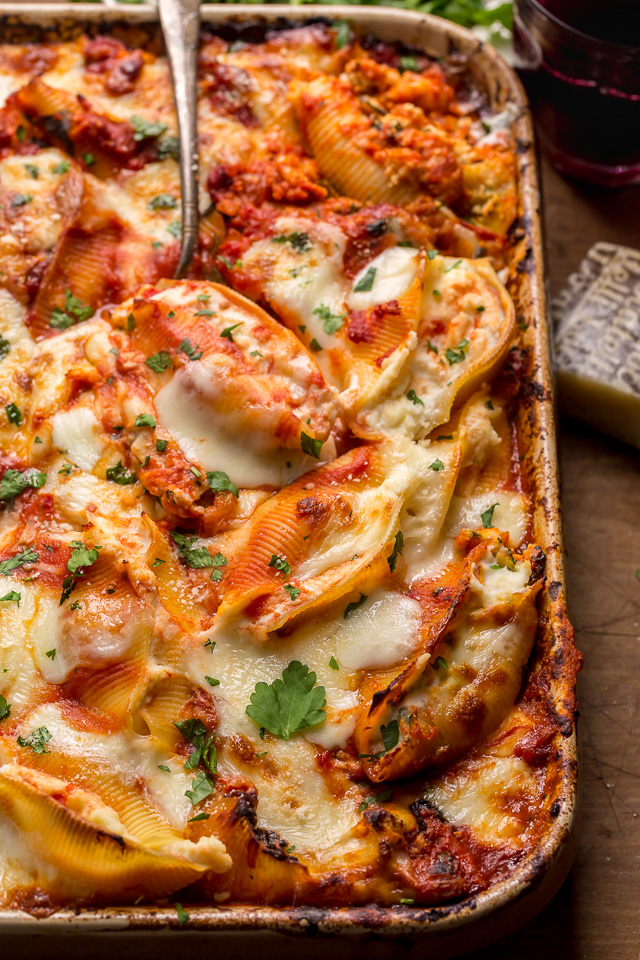 These Crazy Good Classic Stuffed Shells are creamy, gooey, carb-y comfort food at it's best! This family loved recipe features perfectly cooked shells, flavorful tomato sauce, and the most delicious ricotta filling! Sure to become one of your favorite pasta dishes!