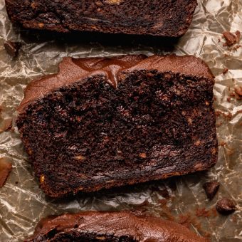 This Extra Moist Chocolate Banana Cake is topped with Espresso Chocolate Ganache! Baked in a load pan, this is a great snacking cake! A great recipe for the when you have ripe bananas and want to bake something other than banana bread!