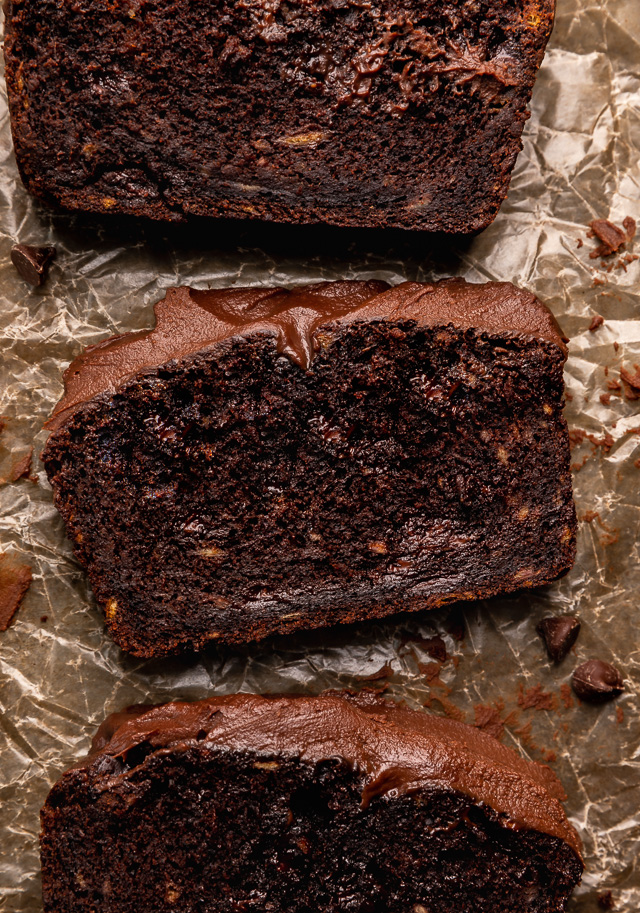 This Extra Moist Chocolate Banana Cake is topped with Espresso Chocolate Ganache! Baked in a load pan, this is a great snacking cake! A great recipe for the when you have ripe bananas and want to bake something other than banana bread!