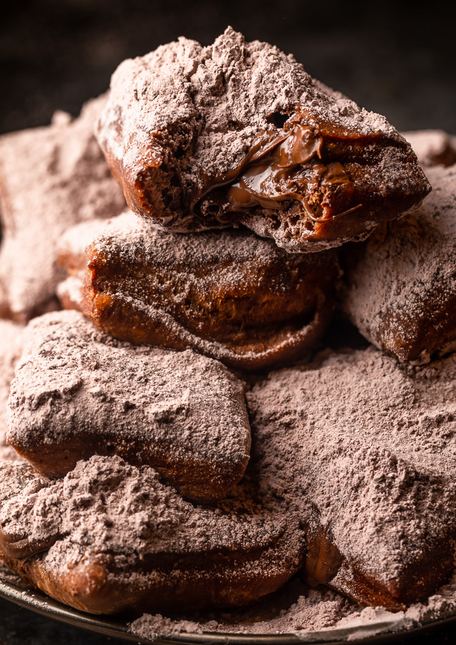 The only thing better than Beignets are Chocolate Filled Beignets! These golden brown treats are light, fluffy, and filled with a gooey pocket of chocolate. If you love beignets and chocolate, you have to try this recipe!