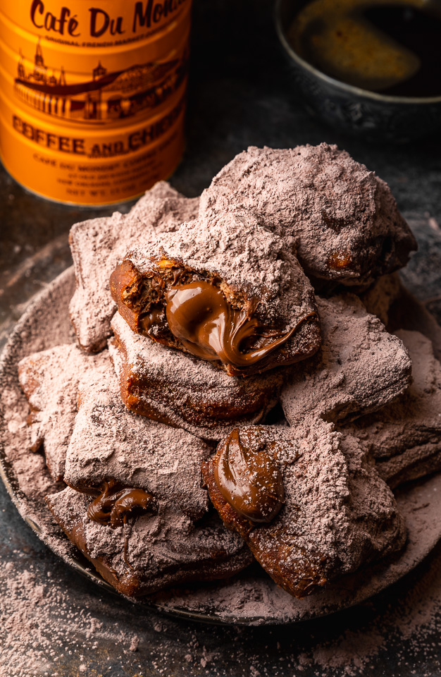 The only thing better than Beignets are Chocolate Filled Beignets! These golden brown treats are light, fluffy, and filled with a gooey pocket of chocolate. If you love beignets and chocolate, you have to try this recipe!