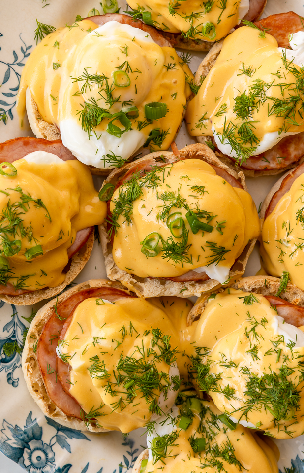 Featuring golden brown toasted English muffins, poached eggs, slices of Canadian bacon, and hollandaise sauce, this Eggs Benedict recipe is pure perfection! Top with freshly chopped dill and scallions, or simply serve with salt and pepper. Perfect for any special at-home breakfast or brunch!