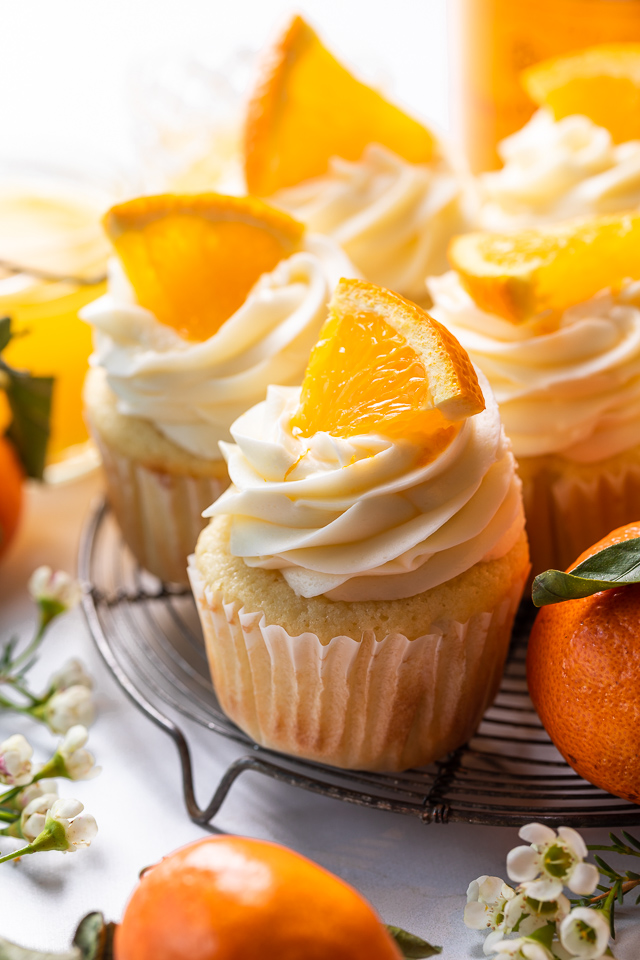 Today I'm teaching you how to make Mimosa Cupcakes! Light and fluffy, these delicious cupcakes are made with freshly squeezed orange juice, orange zest, and of course, CHAMPAGNE! One of my favorite cupcake recipes for brunch or special occasions like Easter, Mother's Day, or New Year's Eve!