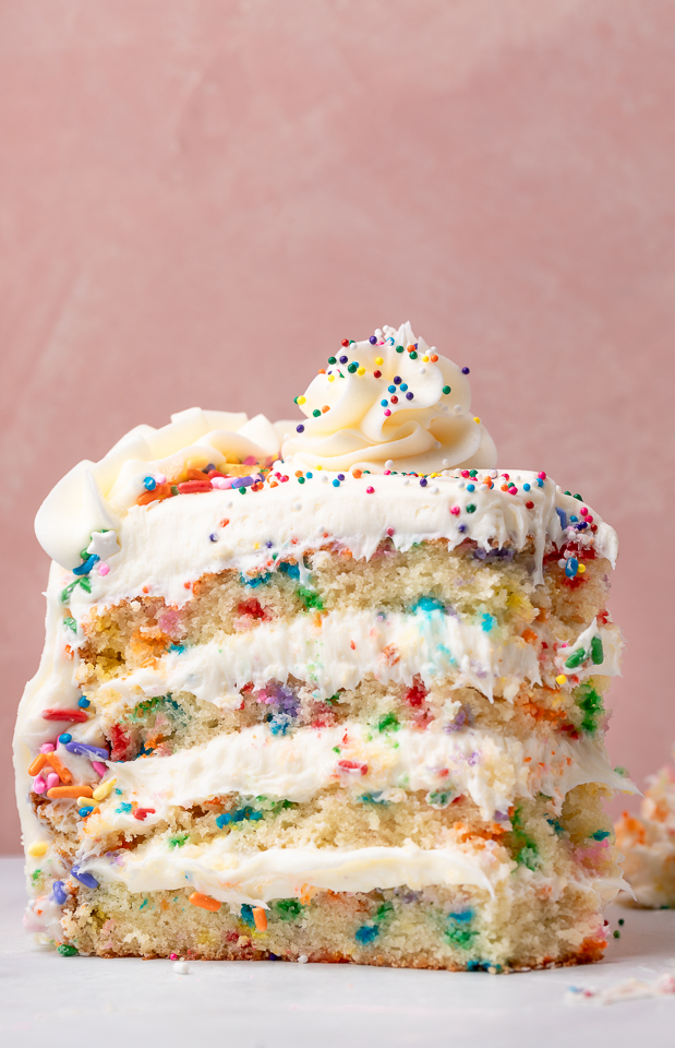 Featuring light and fluffy cake layers that are exploding with rainbow sprinkles and slathered in a silky smooth cream cheese buttercream frosting, this is the Ultimate Funfetti Birthday Cake Recipe!!! Perfect for any special celebration or birthday party! This cake is sure to bring a smile to your face!