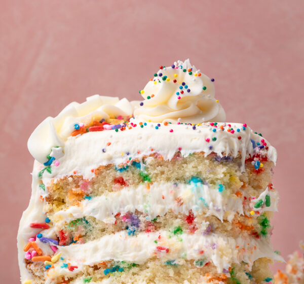 Featuring light and fluffy cake layers that are exploding with rainbow sprinkles and slathered in a silky smooth cream cheese buttercream frosting, this is the Ultimate Funfetti Birthday Cake Recipe!!! Perfect for any special celebration or birthday party! This cake is sure to bring a smile to your face!