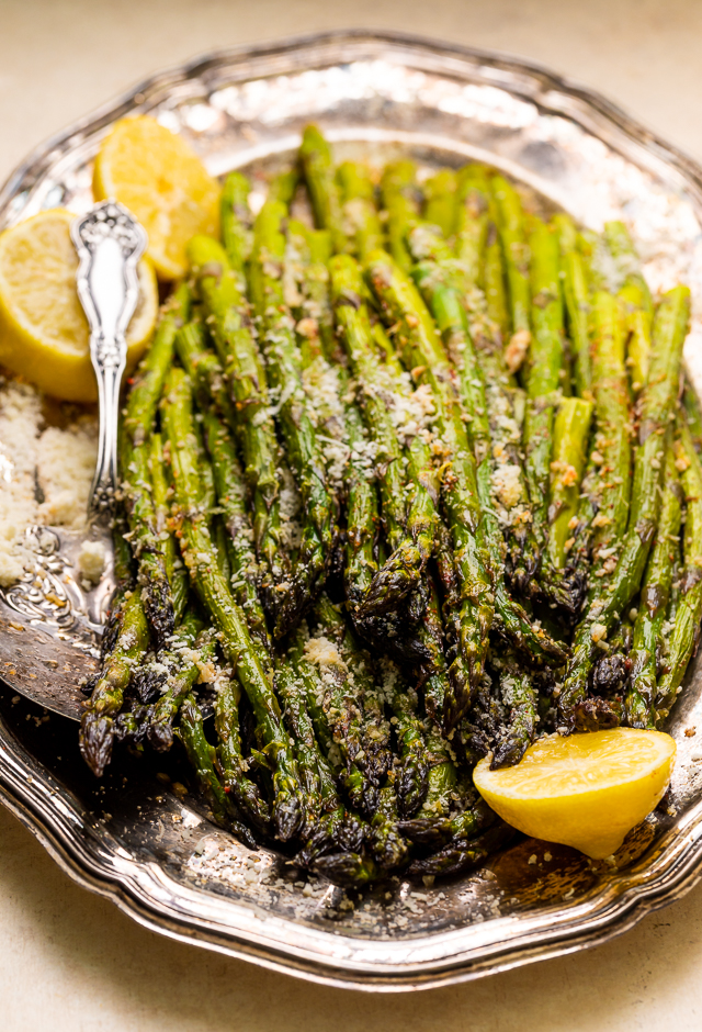 This Lemon Garlic Parmesan Asparagus is a quick and easy side dish that's ready in less than 20 minutes! Perfect with grilled meat, seafood, or a ball of burrata and some charred bread! No matter what you serve it with, I just know you're going to love this recipe!