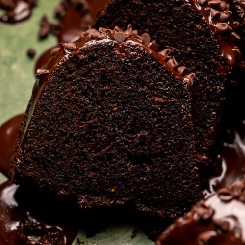 This Chocolate Zucchini Bundt Cake is insanely moist, so fudgy, and loaded with chocolate flavor! No one will even know there's 2 whole cups of shredded zucchini hiding inside! Delicious with chocolate glaze, but can easily be served with whipped cream or a dusting of powdered sugar instead!