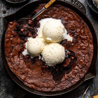 These Easy Skillet Brownies are gooey, fudgy, and so decadent! Made with cocoa powder, melted chocolate, and chocolate chips, these fudgy brownies are definitely for chocolate lovers only! Serve warm, with a few giant scoops of vanilla ice cream on top!