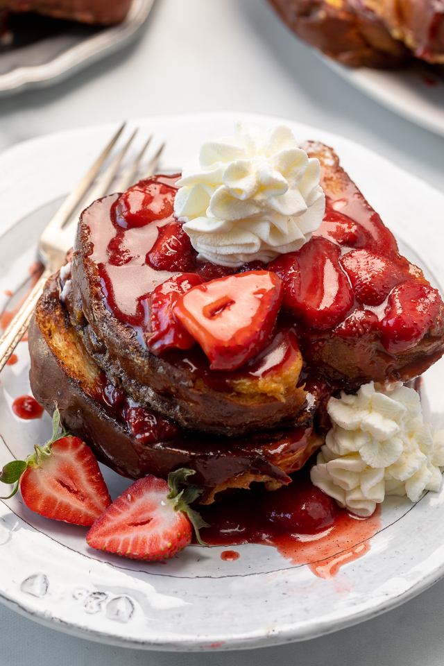 Strawberries and Cream French Toast features buttery slices of brioche bread, fresh strawberries, and whipped cream! A fancy restaurant-quality recipe that's perfect for Easter, Mother's Day, or a bridal shower brunch! This recipe can easily be doubled if you're serving a large crowd!