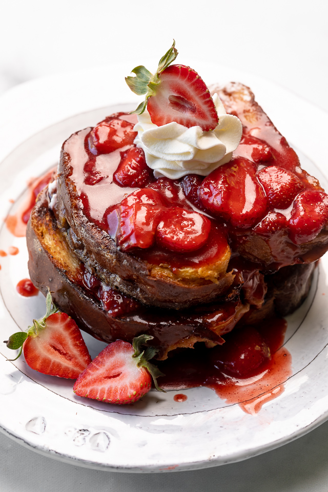 Strawberries and Cream French Toast features buttery slices of brioche bread, fresh strawberries, and whipped cream! A fancy restaurant-quality recipe that's perfect for Easter, Mother's Day, or a bridal shower brunch! This recipe can easily be doubled if you're serving a large crowd!