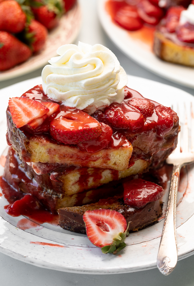 Strawberries and Cream French Toast features buttery slices of brioche bread, fresh strawberries, and whipped cream! A fancy restaurant-quality recipe that's perfect for Easter, Mother's Day, or a bridal shower brunch! This recipe can easily be doubled if you're serving a large crowd!
