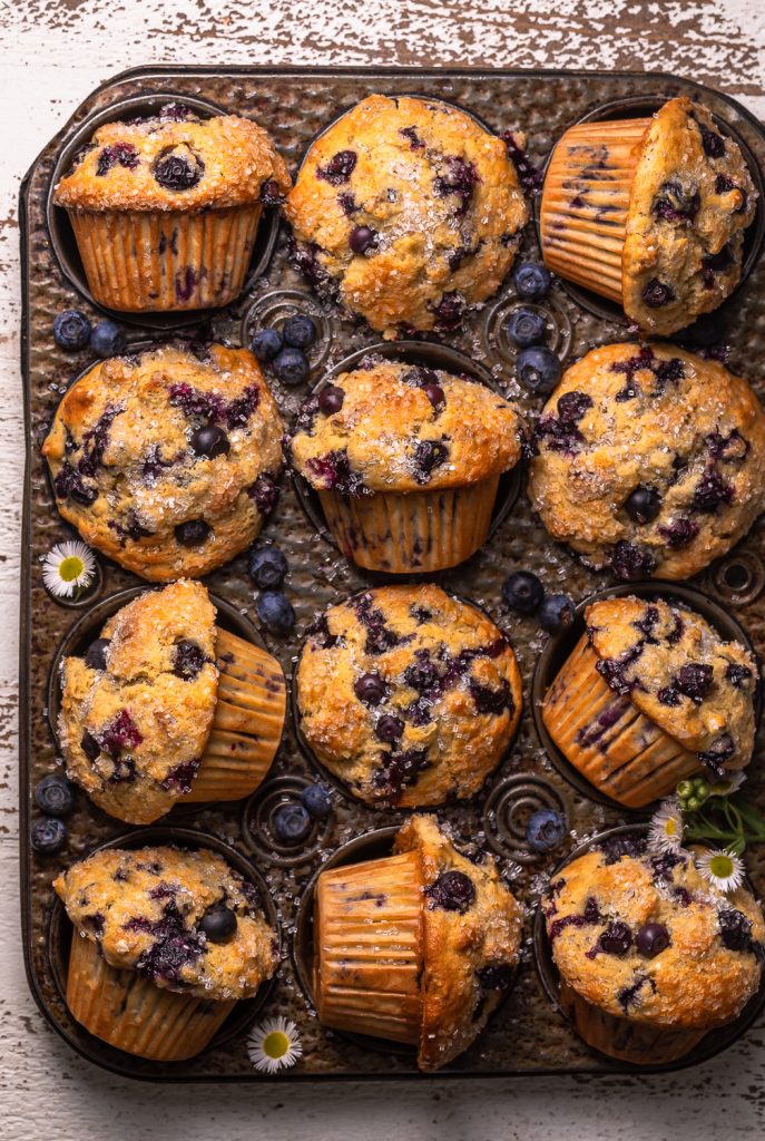 Banana blueberry muffins in a muffin pan. 