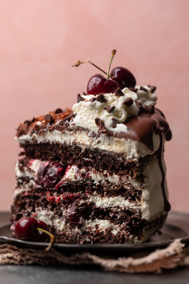 Featuring moist chocolate cake layers, a fresh cherry filling, and a light whipped cream frosting, my mile-high Black Forest cake is a total showstopper! Make it even more stunning by garnishing with mini chocolate chips pressed up the side of the cake, and chocolate shavings and fresh cherries on top. Beautiful, delicious, and surprisingly easy, this cake is sure to be the star of your dessert table!