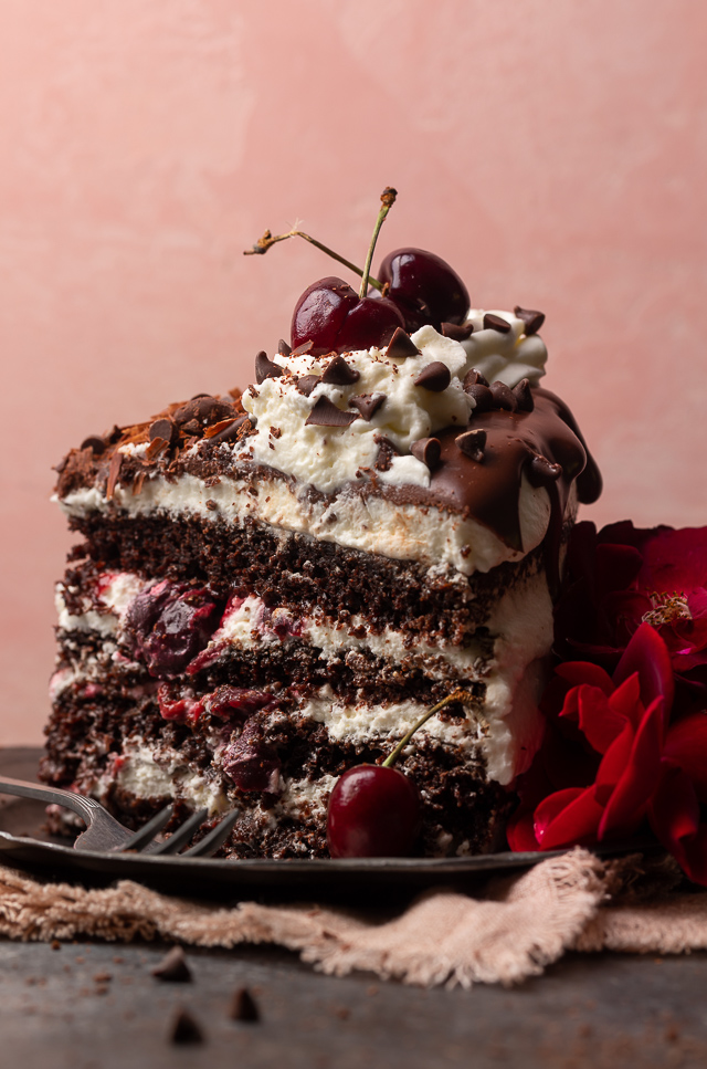 Featuring moist chocolate cake layers, a fresh cherry filling, and a light whipped cream frosting, my mile-high Black Forest cake is a total showstopper! Make it even more stunning by garnishing with mini chocolate chips pressed up the side of the cake, and chocolate shavings and fresh cherries on top. Beautiful, delicious, and surprisingly easy, this cake is sure to be the star of your dessert table!