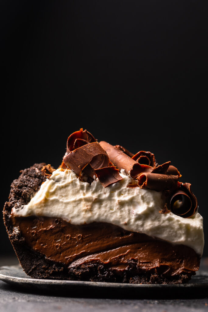 Chocolate pudding pie on a plate.