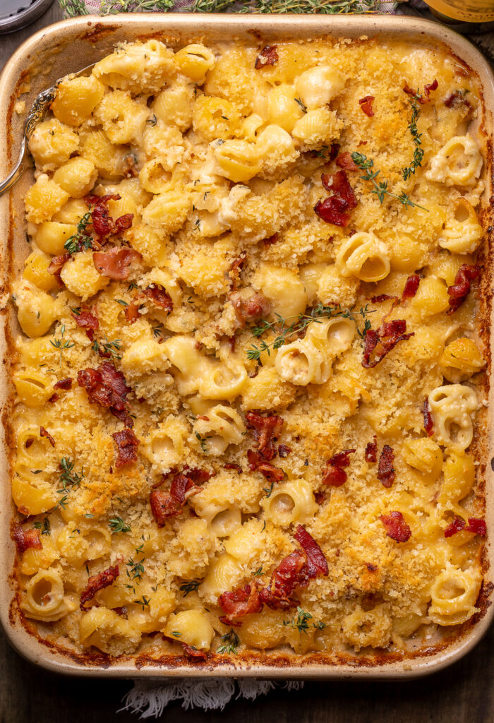 Baking dish with macaroni and cheese topped with bacon.