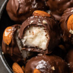 If you like almond joy candy bars, you'll love these almond joy truffles! The coconut mixture is so creamy, it almost tastes like cheesecake, and the rich robe of milk chocolate makes them so decadent! But feel free to dip in dark chocolate for a less sweet treat!
