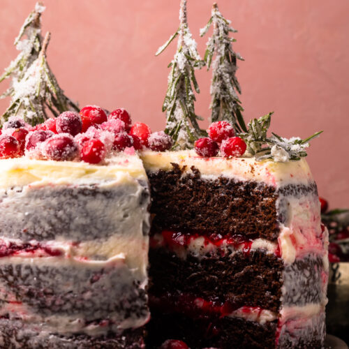 Featuring three layers of chocolate espresso cake, creamy mascarpone buttercream frosting, and a sweet cranberry filling, this Chocolate Cranberry Christmas Cake is a total showstopper! The perfect holiday dessert to wow your guests this year!