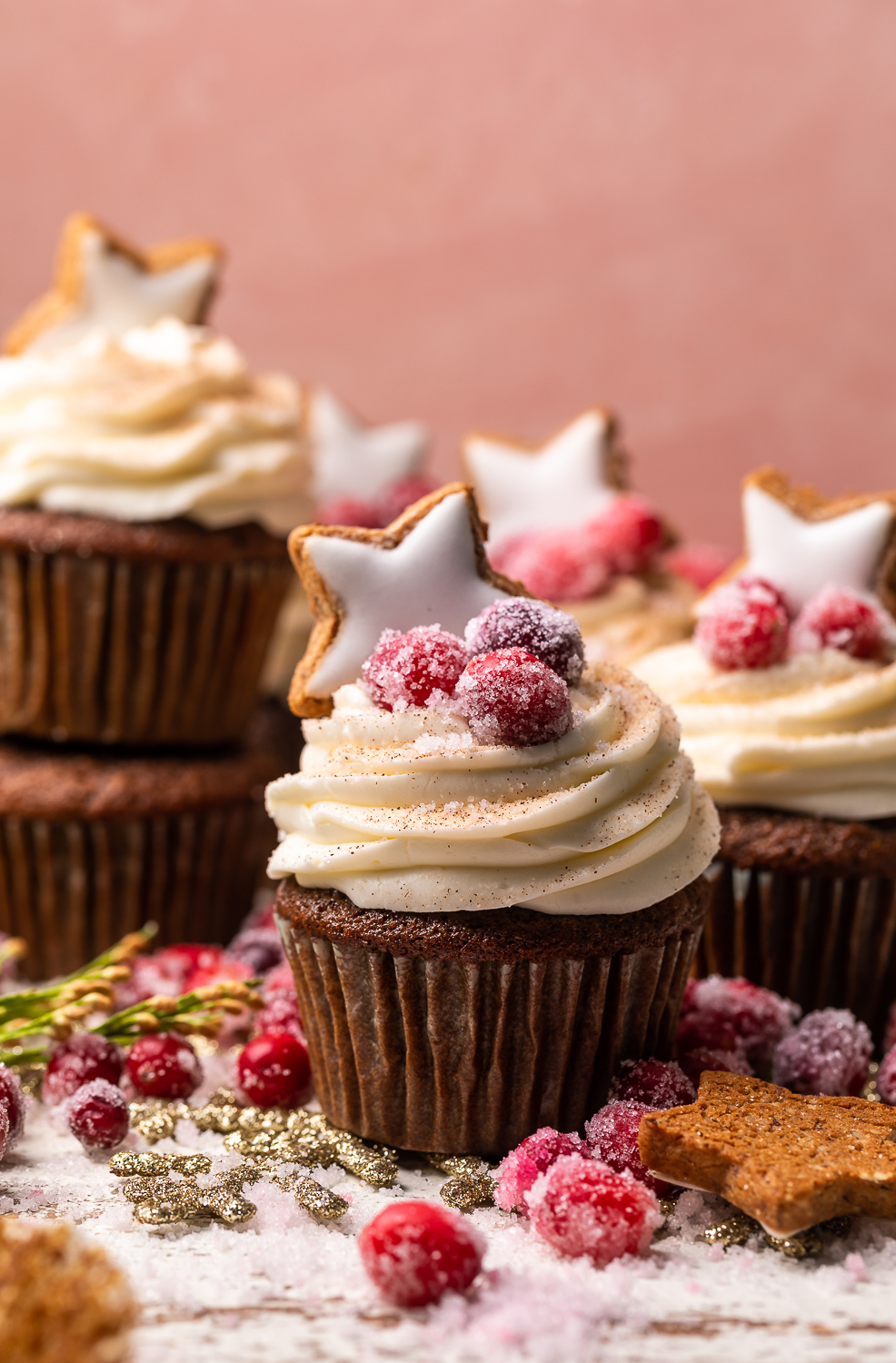 Gingerbread Cupcakes are topped with Mascarpone Frosting and Maple Candied Cranberries! Moist, fluffy, and so flavorful, these are a holiday classic! And the perfect crowd-pleasing holiday dessert recipe for your next party!