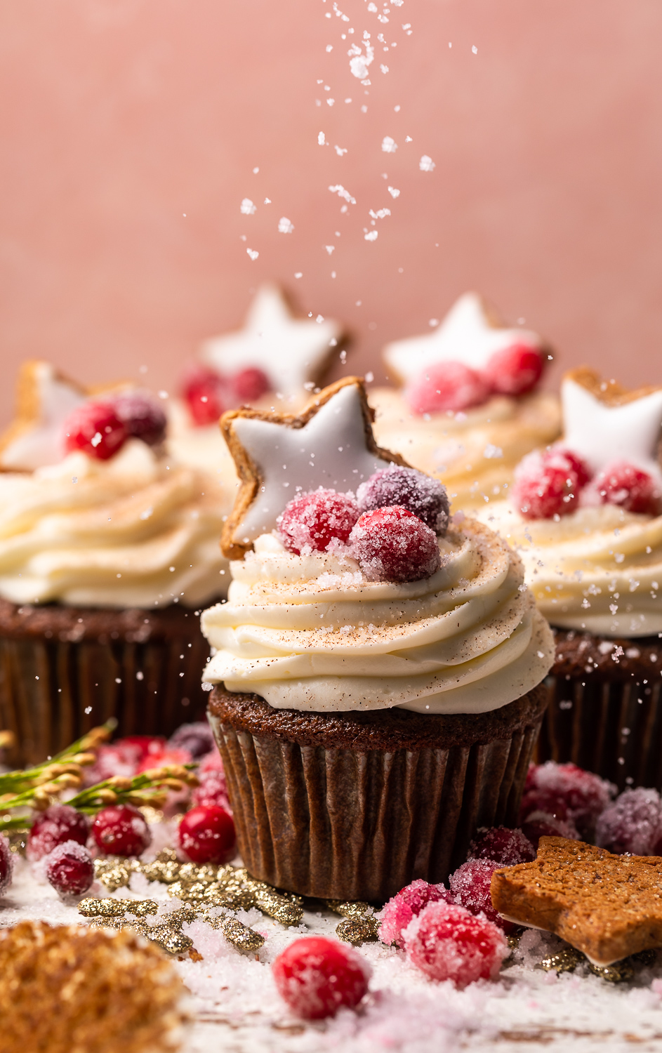 Gingerbread Cupcakes are topped with Mascarpone Frosting and Maple Candied Cranberries! Moist, fluffy, and so flavorful, these are a holiday classic! And the perfect crowd-pleasing holiday dessert recipe for your next party!
