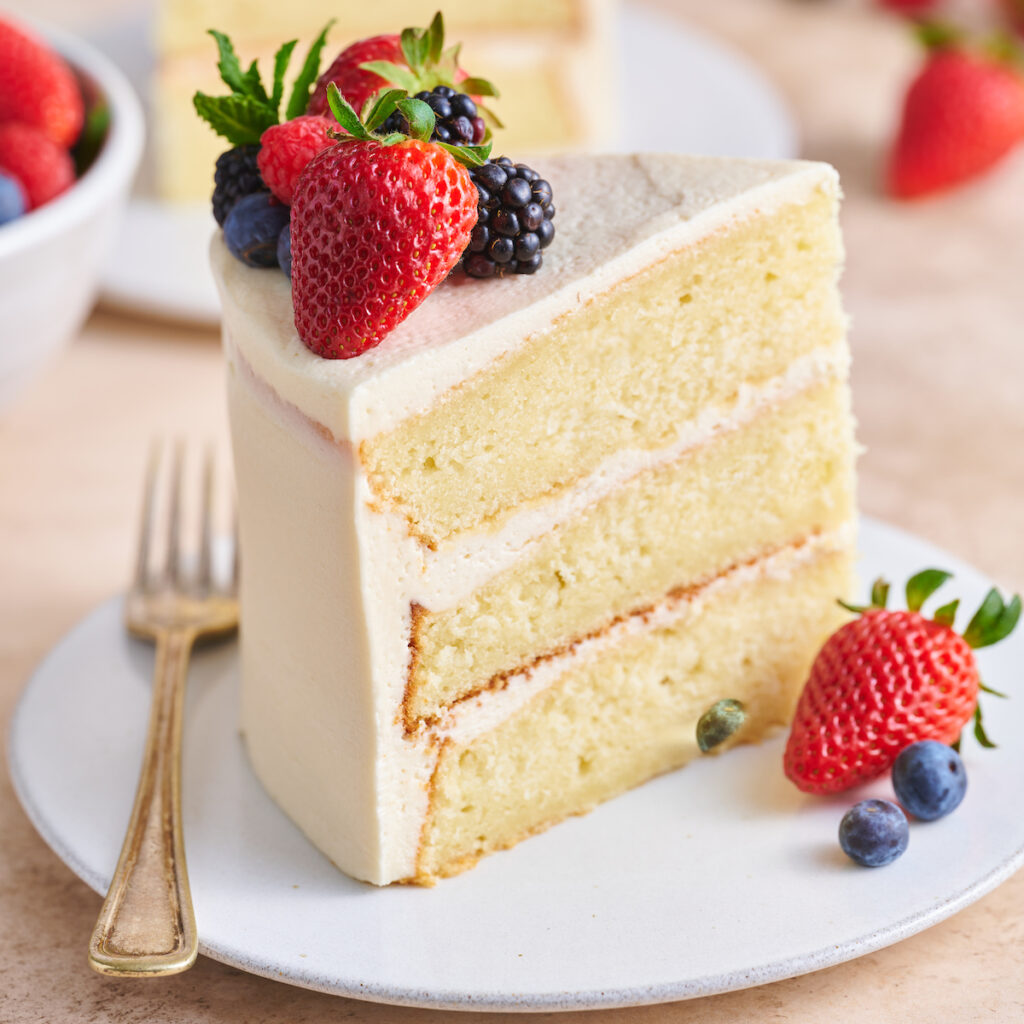 The best vanilla cake recipe covered in vanilla buttercream frosting.