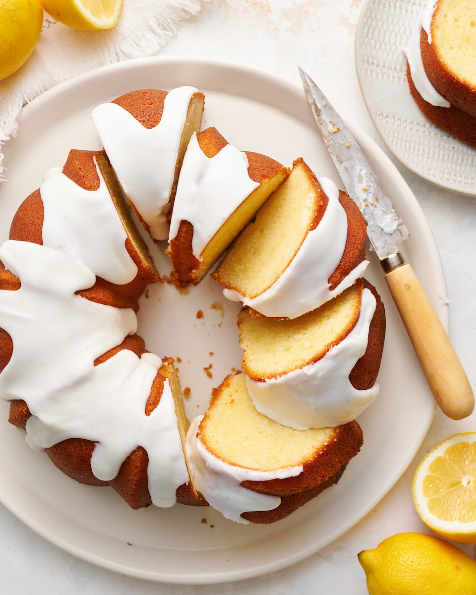 This Lemon Glazed Lemon Bundt Cake is light and fluffy and loaded with lemon flavor! One of my all time favorite lemon desserts and perfect for any lemon lover! Baked in a 12-cup bundt pan, this cake requires very little assembly but still looks stunning!