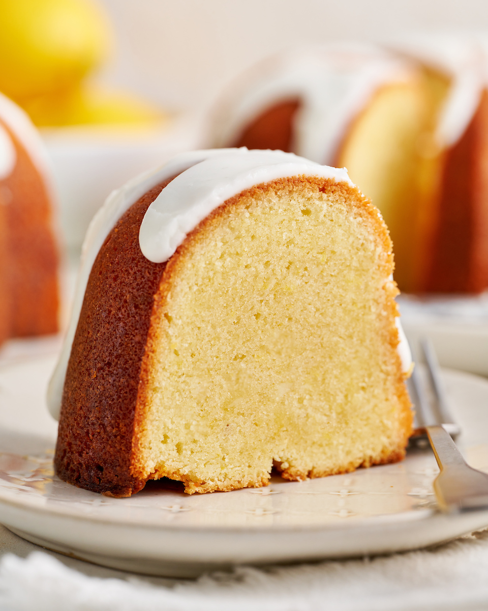 This Lemon Glazed Lemon Bundt Cake is light and fluffy and loaded with lemon flavor! One of my all time favorite lemon desserts and perfect for any lemon lover! Baked in a 12-cup bundt pan, this cake requires very little assembly but still looks stunning!