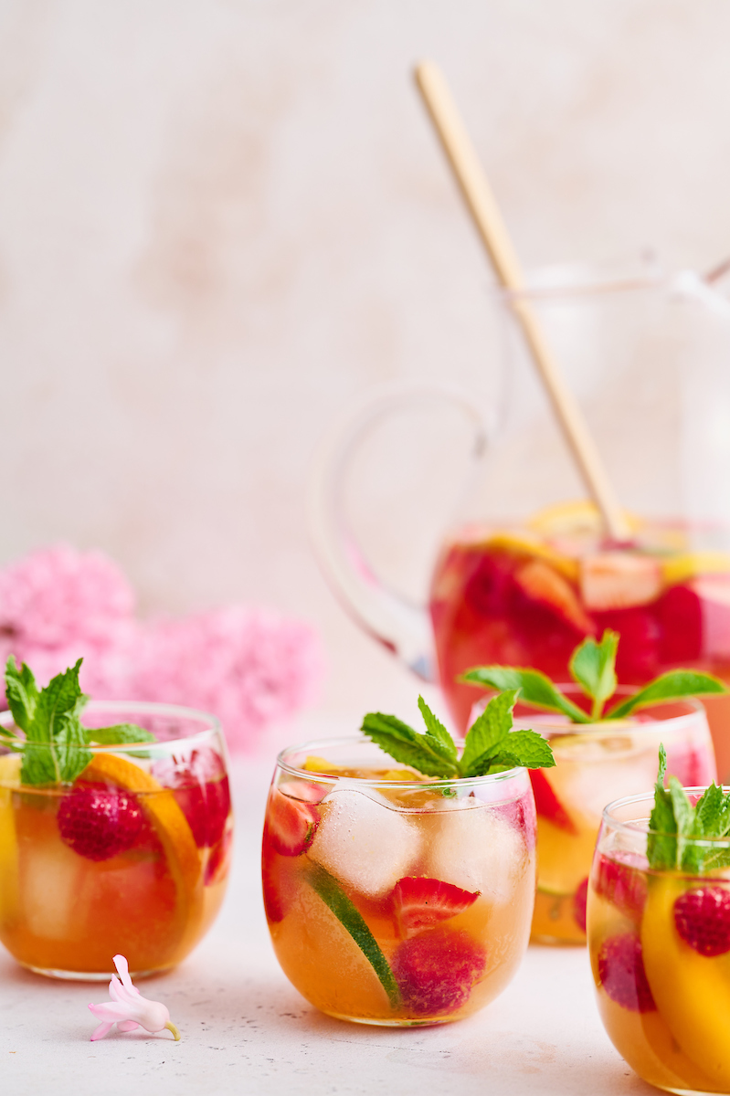 The only thing better than rosé wine is rosé sangria! And this refreshing rosé sangria recipe is made in a large pitcher and chilled in the fridge so it's ready to serve when your guests arrive. Garnish with fresh raspberries, strawberries, and citrus slices for a stunning presentation.
