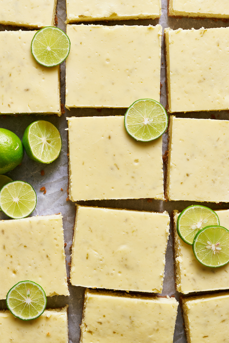 If you like key lime pie and cheesecake, you'll love key lime cheesecake bars! Featuring a crunchy graham cracker crust and a creamy key lime-flavored cheesecake filling, they're just begging to be topped with a dollop of whipped cream. Baked in a 9x13-inch baking pan, these bars easily serve a crowd.