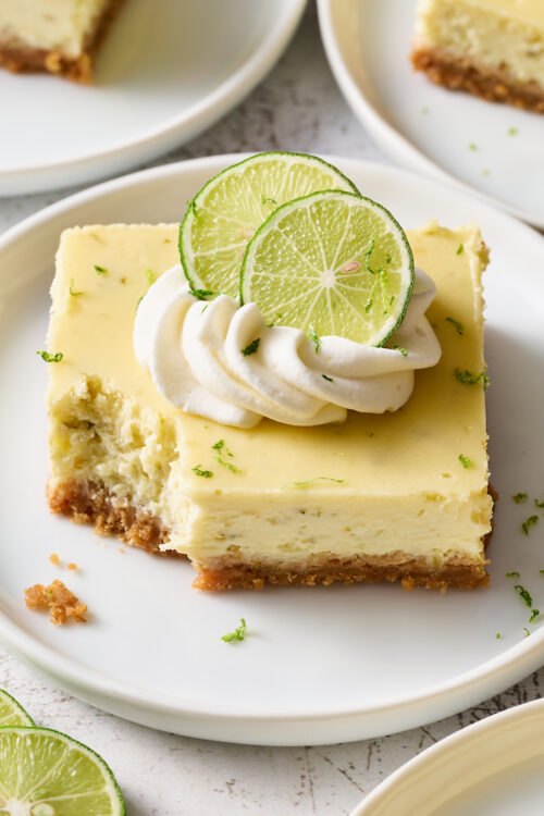 If you like key lime pie and cheesecake, you'll love key lime cheesecake bars! Featuring a crunchy graham cracker crust and a creamy key lime-flavored cheesecake filling, they're just begging to be topped with a dollop of whipped cream. Baked in a 9x13-inch baking pan, these bars easily serve a crowd.